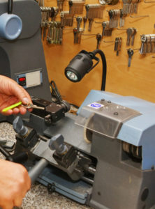 A person working on a machine in a shop.